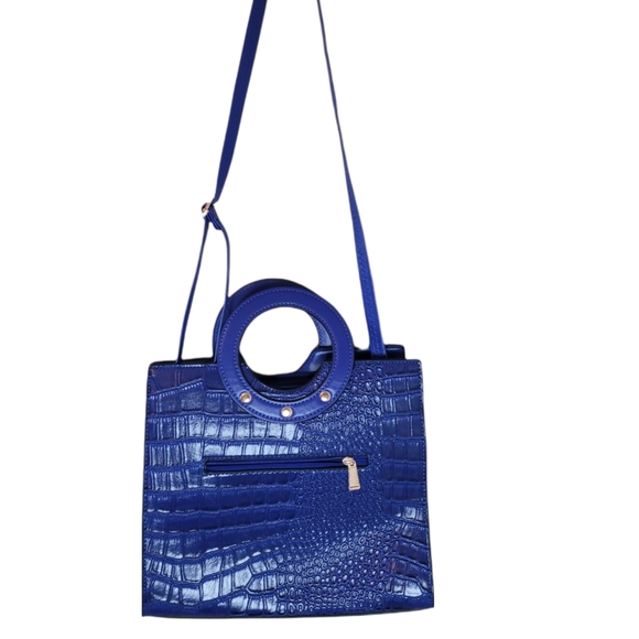 Muriells Closet Handbags - Muriells Closet Royal Blue alligator print purse. Circular handle.